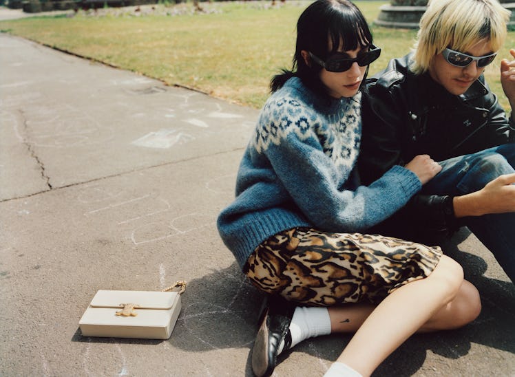 Earl Cave wears Celine Homme by Hedi Slimane clothing and belt; his own sunglasses. Devon Ross wears...