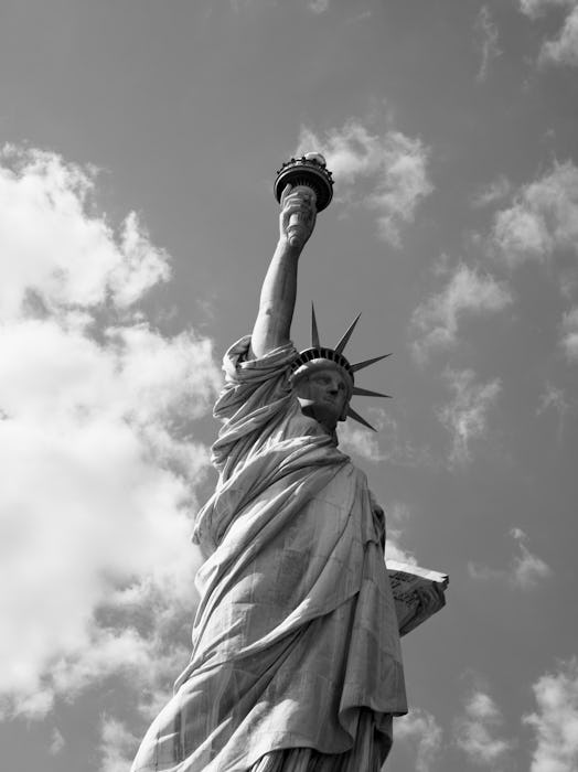 A black and white photo of the Statue of Liberty