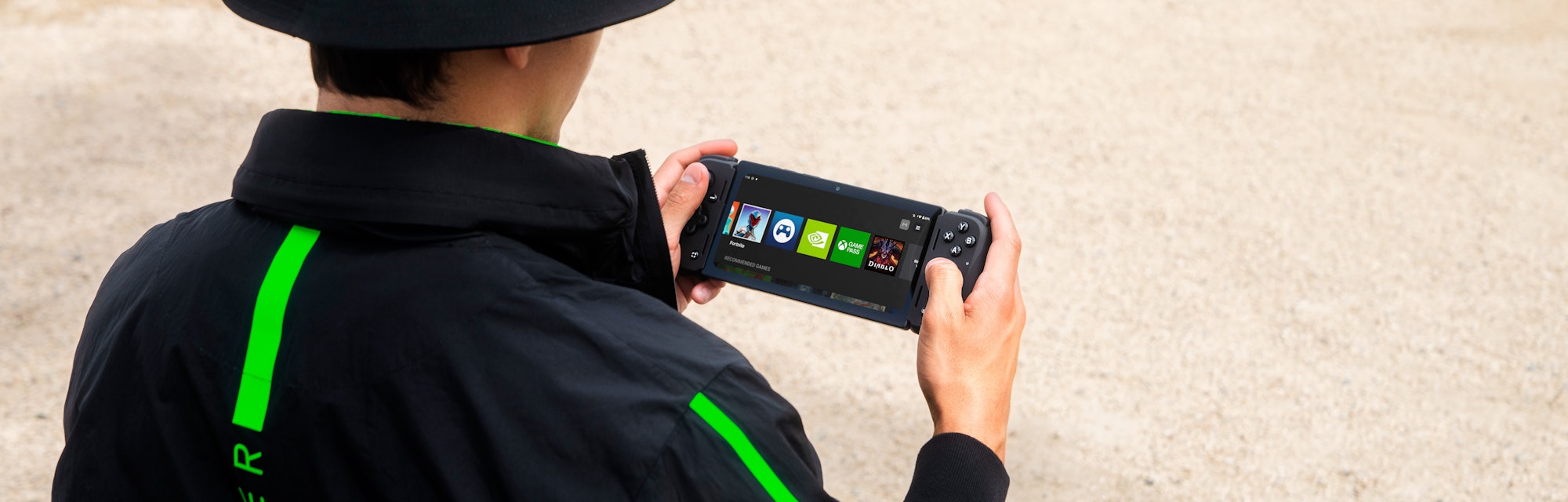 The Razer Edge handheld being used outside.