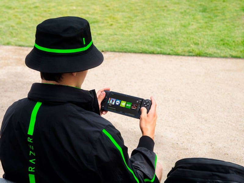 The Razer Edge handheld being used outside.