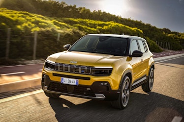 Yellow Jeep Avenger electric SUV on road