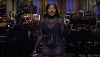 megan thee stallion wearing a black sheer mesh mini dress with a corset over top