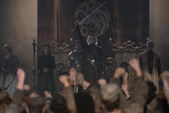 Aegon II Targaryen (Tom Glynn-Carney) holds his sword in the air in House of the Dragon Episode 9