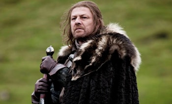 Sean Bean holds a sword as Ned Stark in Game of Thrones Season 1