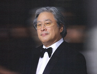 A portrait of Park Chan-wook wearing a tuxedo