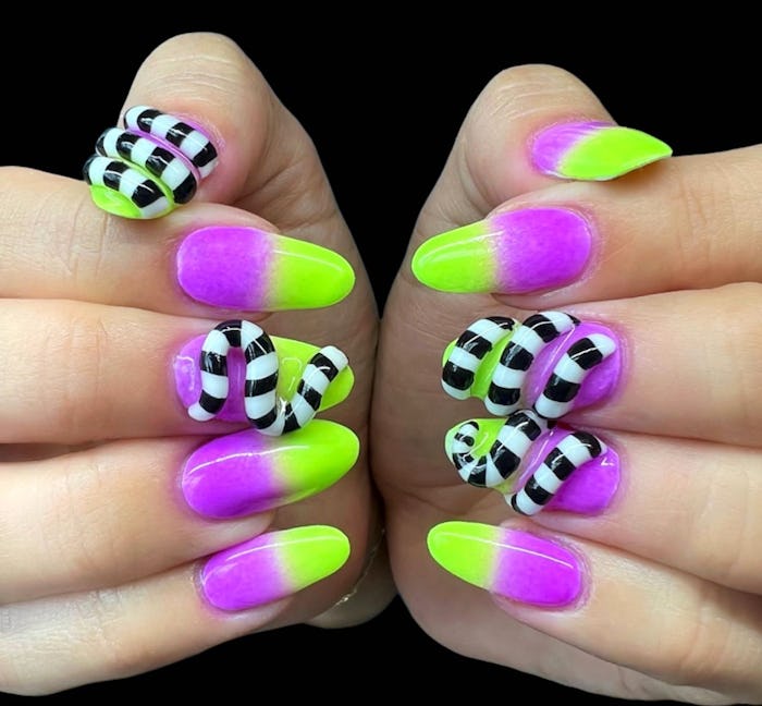 Neon purple and green nails with 3D sandworm Beetlejuice nail art