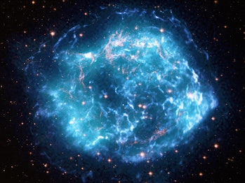 It resembles a hazy ball of turquoise and neon blue lightning, marbled with veins of gold.