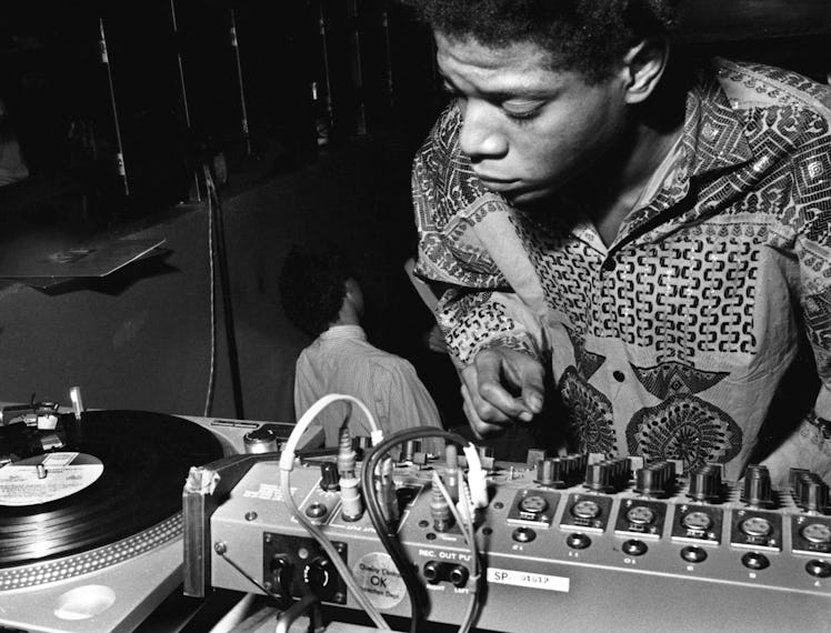 A photo of Jean Michel Basquiat spinning decks