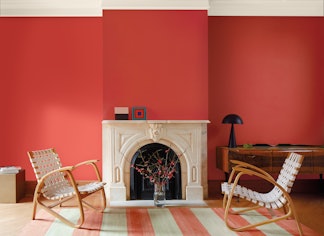 Living room with a white fireplace painted in Benjamin Moore's Raspberry Blush