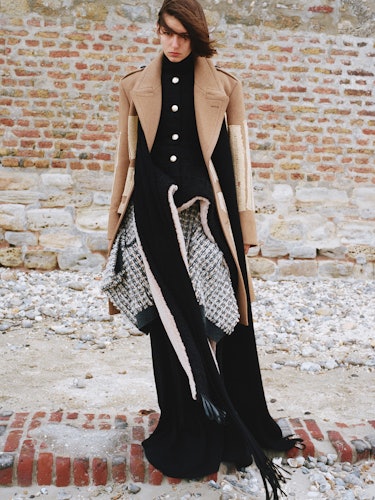 Rayssa Medeiros wears a wool coat and dress.