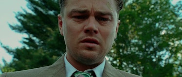 Leonardo DiCaprio looking down while crying in Shutter Island