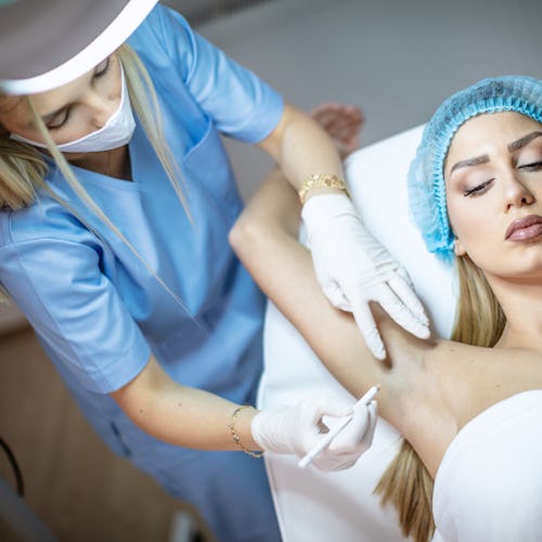 A woman during the Botox treatment for underarm sweating