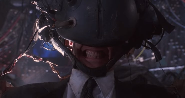 Keanu Reeves strapped to brain uploading device