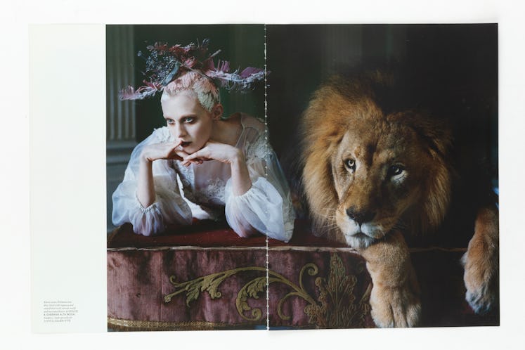 Tearsheet in Katie Grand’s Tears and Tearsheets book of Karen Elson with feather headpiece and Atlas...