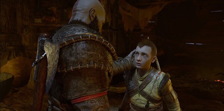 Kratos with his hand on Atreus' head in God of War: Ragnarök
