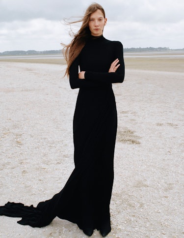 Emese Nyiro wears a black dress.