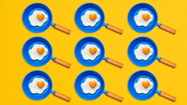 An illustration of nine blue pans with fried eggs 