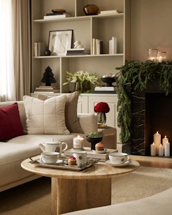 Living room decorated with items found in H&M Home’s 2022 Holiday Shop.