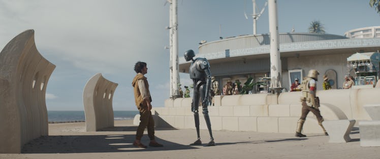 Cassian talking with a security droid on Niamos