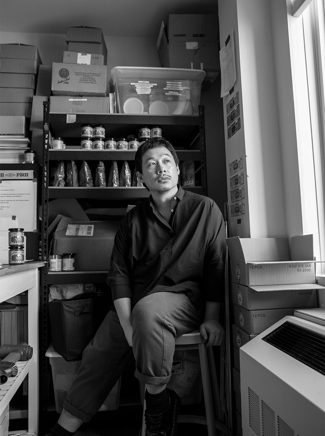 A portrait of Geraldson Chua in black and white