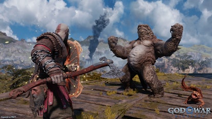 Kratos challenging a terrifying bear in God of War Ragnarok