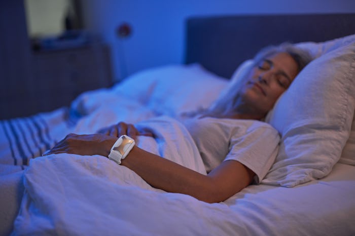Sleeping woman wearing Apollo wearable device