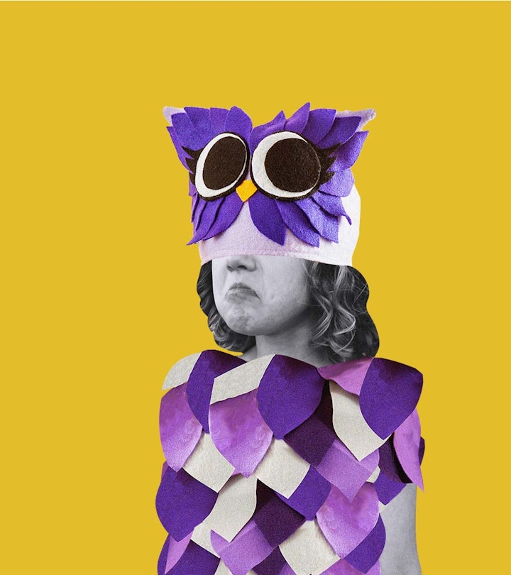 An angry-looking girl in a Dumpy owl Halloween costume