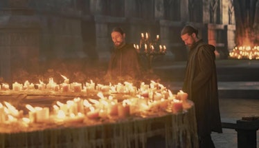 The Cargyll Twins  next to a lot of candles burning next to each other