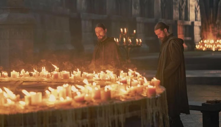 The Cargyll Twins  next to a lot of candles burning next to each other