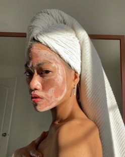 Model with face mask and towel on