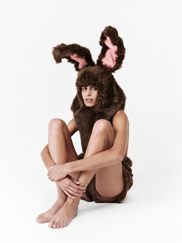 Model wears a bunny ears hat.