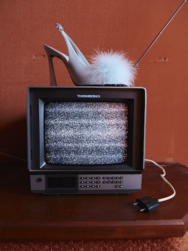 Sandal on top of a tv.