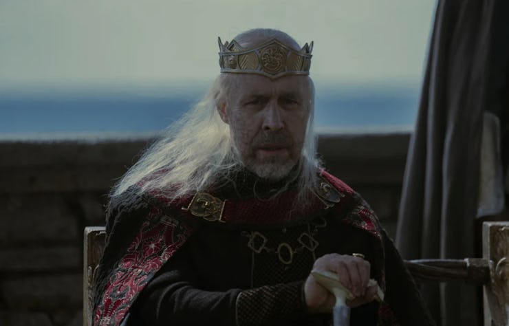 Old King Viserys sitting with his stick