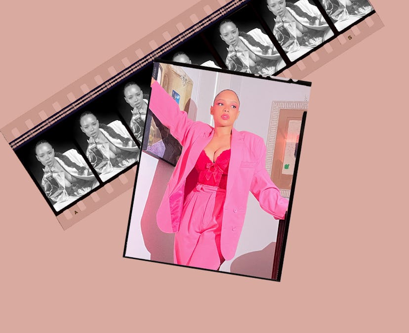 Sisi Stringer in a bright pink suit with a matching corset top and a slicked-back ponytail.