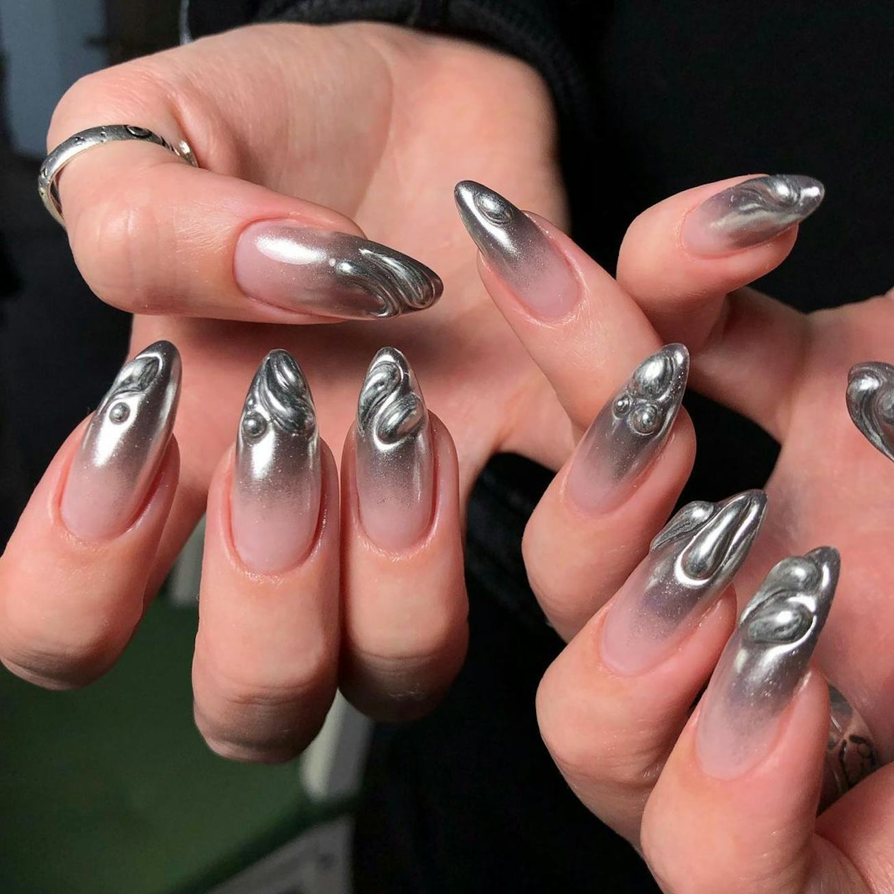 3D metallic manicure inspired by the horoscope sign of Scorpio.