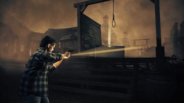 Alan Wake shining a light on an abandoned town in Alan Wake's American Nightmare