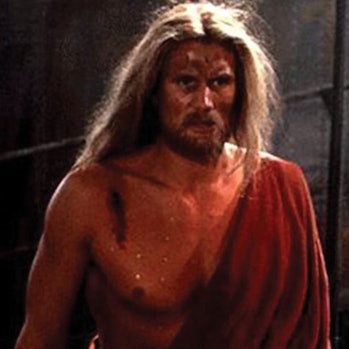 Dolph Lundgren in more revealing robes as The Street Preacher.