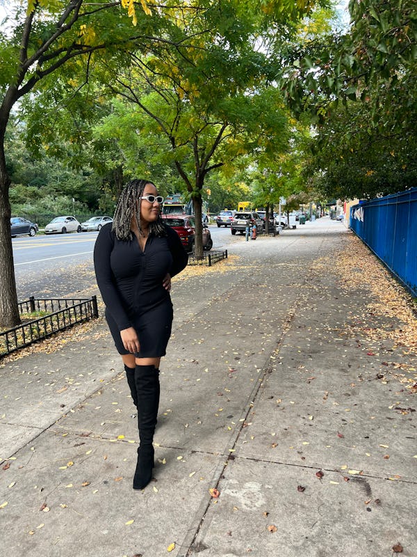 A mid-size woman posing in an Abercrombie black long-sleeve shirt dress