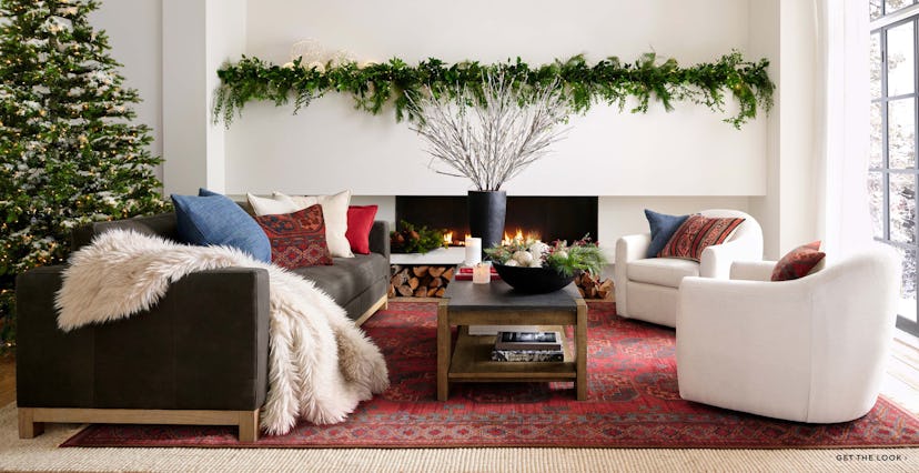 Rustic and cozy living room decorated with items from Pottery Barn's holiday collection