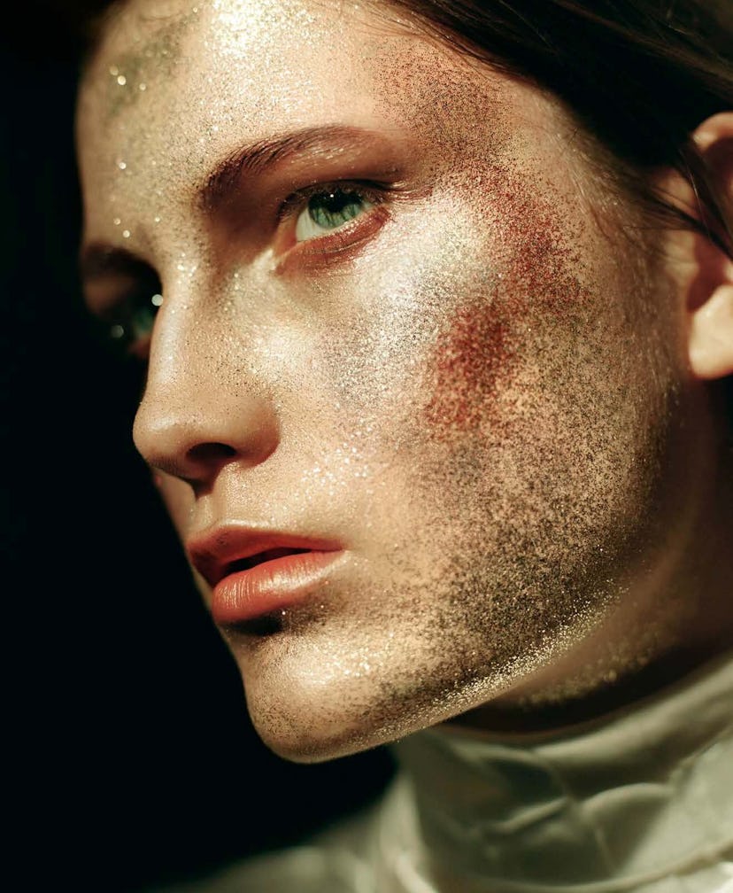 A model with glitter on her cheeks