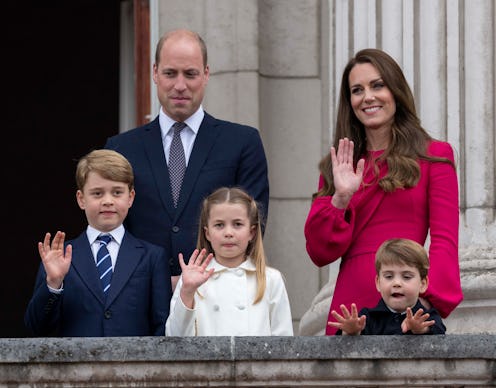 Prince William and Kate Middleton posing with their children, George, Charlotte and Louis