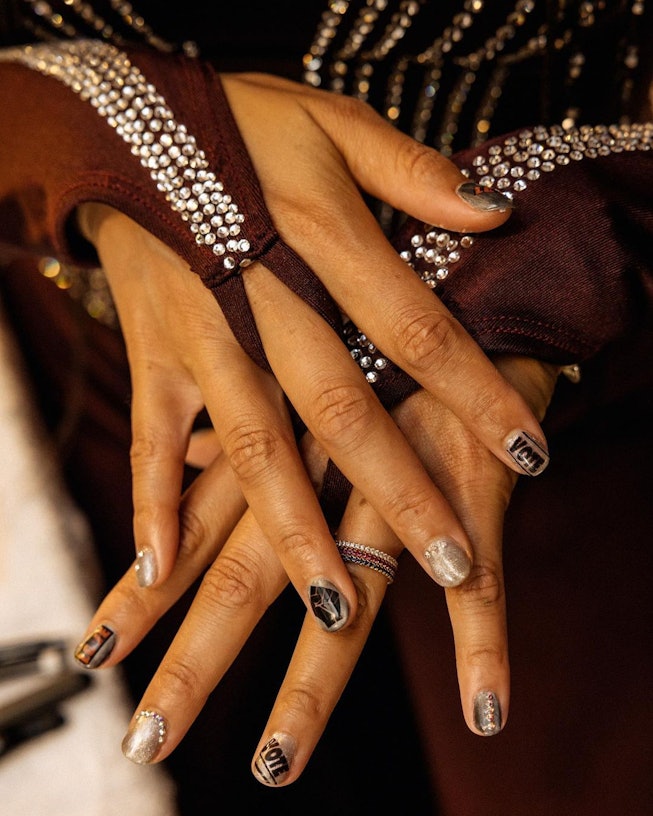 Alicia Keys showing off her nail designs, encouraging voting