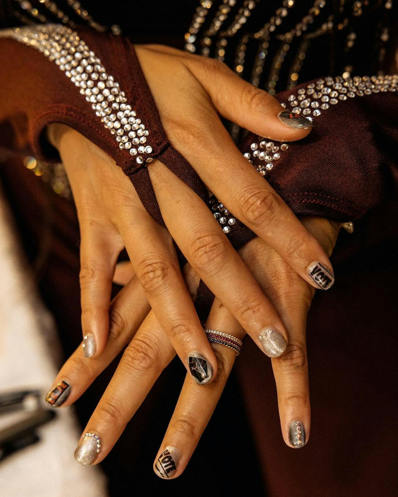 Alicia Keys showing off her nail designs, encouraging voting