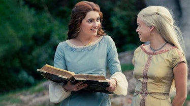Rhaenyra talking to Alicent, who's holding and reading a book