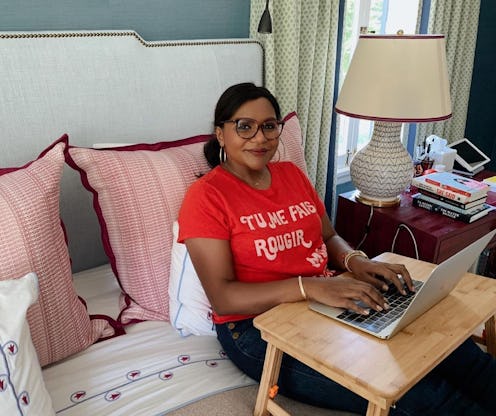 Mindy Kaling by the laptop in her colorful, celebrity-styled bedroom