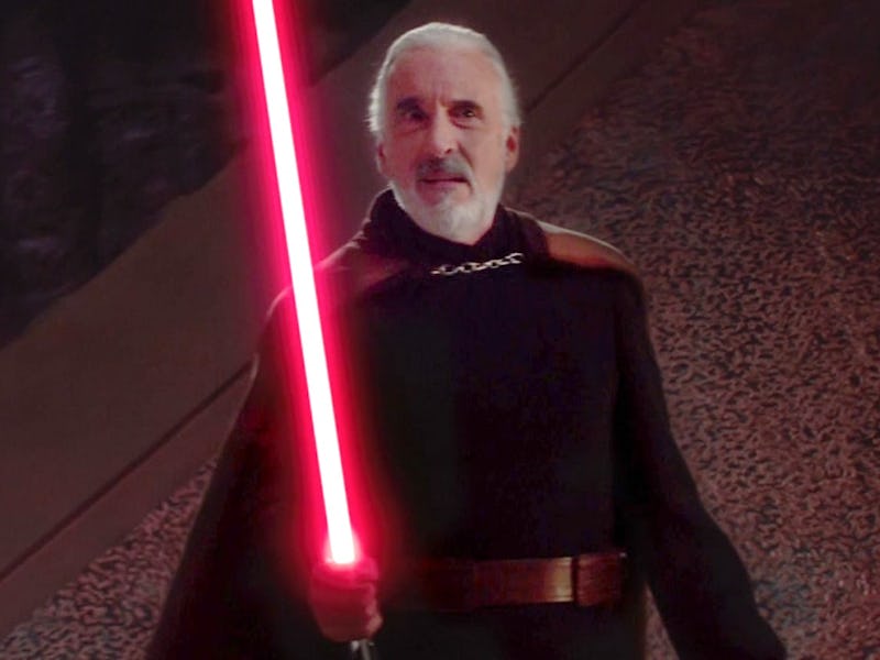 Grof Dooku holding a red lightsaber