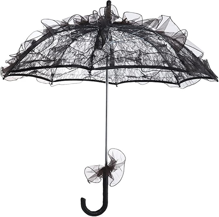 All-black halloween costumes include coven's supreme witch using this lace parasol umbrella.