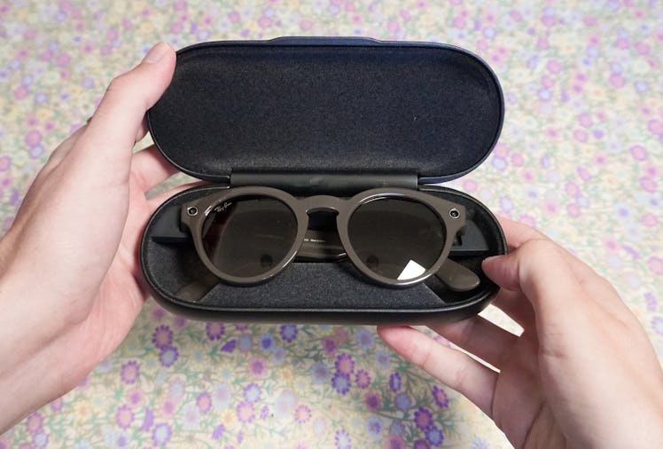 The Ray-Ban Stories charging in their case.