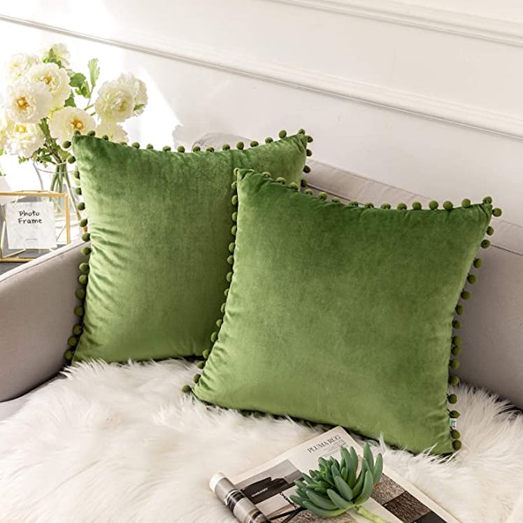 Taylor Swift's "Anti-Hero" music video decor for your home includes these green pillows. 