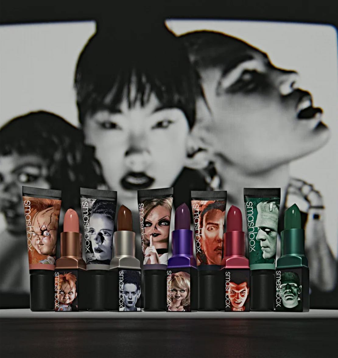 Cover of a catalogue with a model in black and white and four strong colored lipsticks in the focus